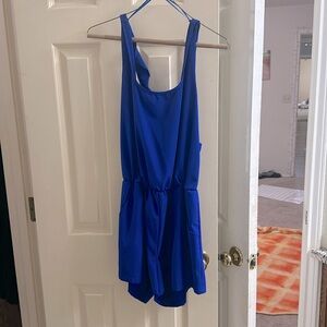 Royal blue romper with pockets & bow in the back